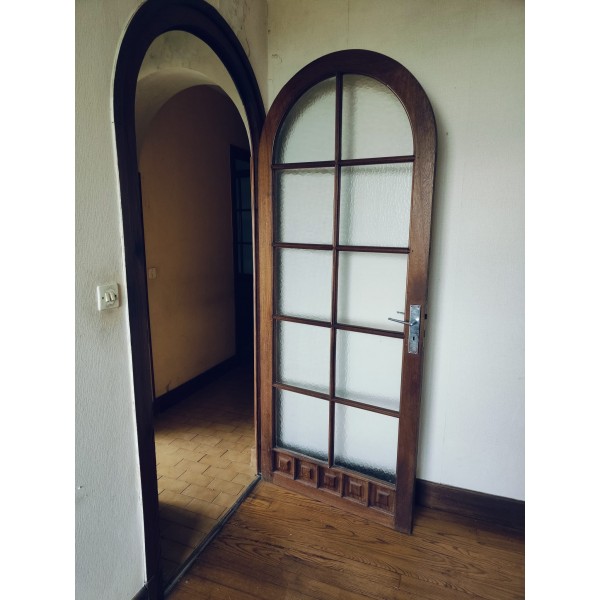 Porte bois vitrée cintrée
